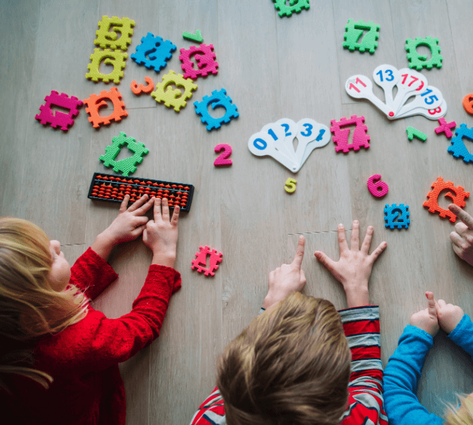 Children playing with educational toys and learning materials